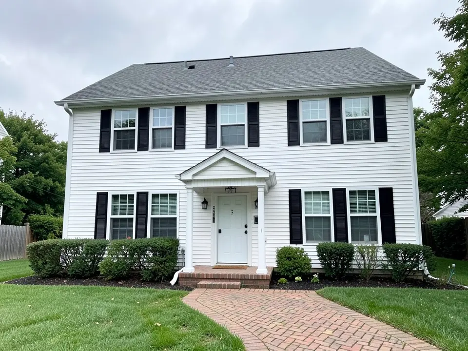 AI-drawn generic stand-in of a two-story colonial style house with white horizontal vinyl siding, black shutters, a white front door under a small gabled portico, a gray shingle roof and a brick-paved walkway