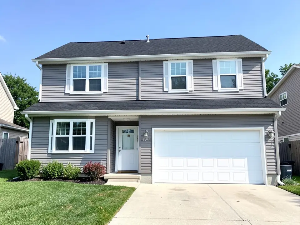 AI-drawn generic stand-in of a two-story house with medium gray horizontal siding, bright white window trim and frames, a white front door, a white garage door and a black shingle roof