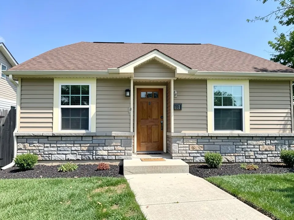 AI-drawn generic stand-in of a one-story house with beige horizontal siding, cream window trim, a gray stone base, a stained wood front door and a brown shingle roof