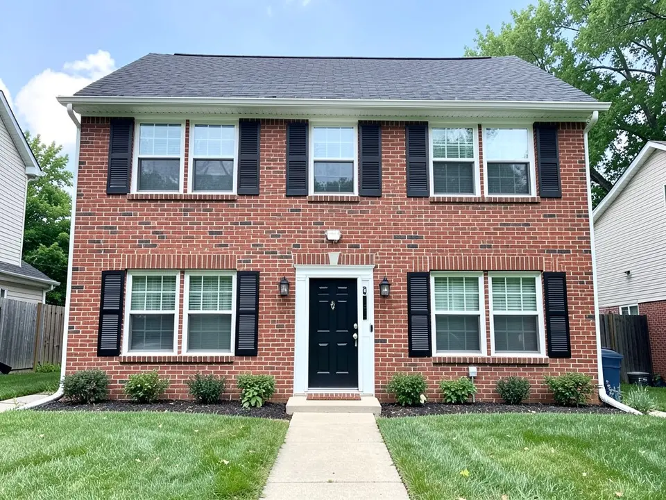 AI-drawn generic stand-in of a two-story red brick house with black louvered shutters flanking the front windows (ten shutters), white window trim, a black front door and a dark gray roof