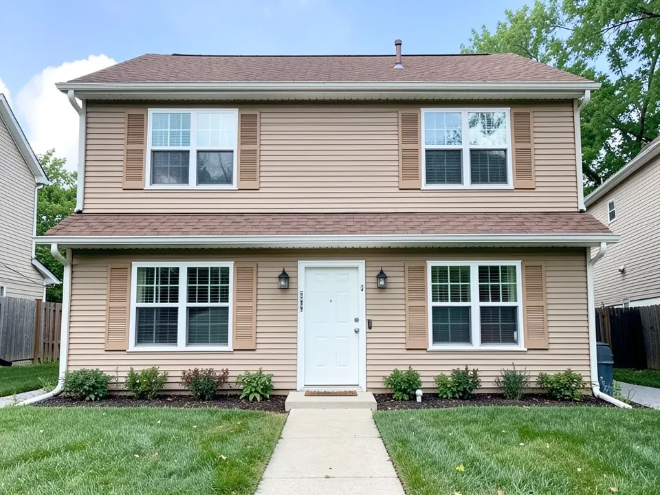 AI-drawn generic stand-in of a two-story tan vinyl-sided house with tan louvered shutters almost the same color as the walls, white window trim, a white front door and a brown roof
