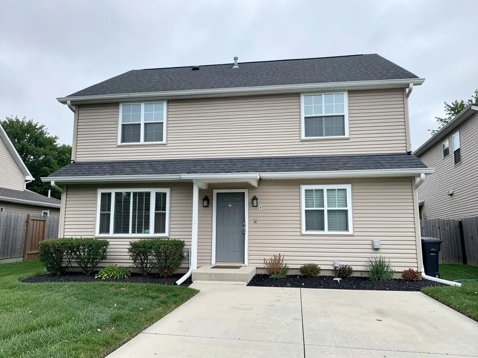 AI-drawn generic stand-in of a two-story suburban house with beige vinyl lap siding, white window trim, a dark gray roof, a gray front door and a concrete driveway